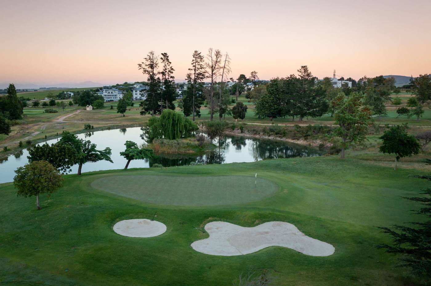 Stellenbosch Golf Club pond and green, golden hour